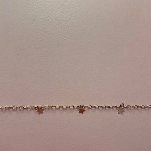 Never worn gold star necklace